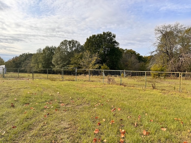 view of yard with a rural view