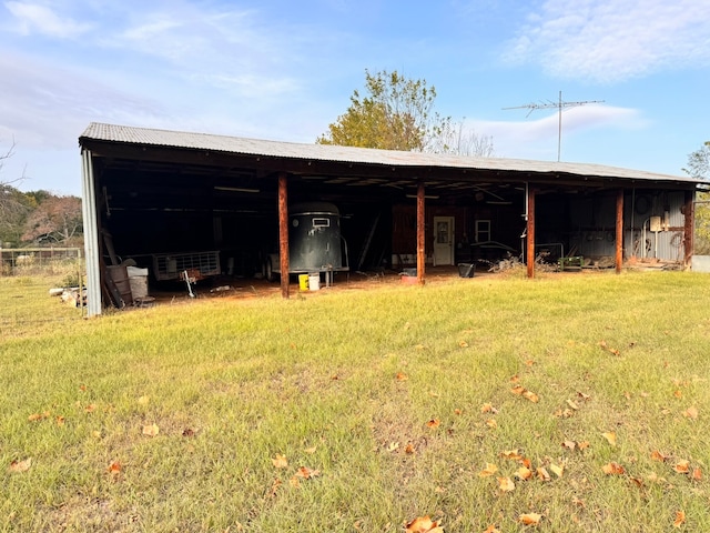 view of outbuilding with a lawn