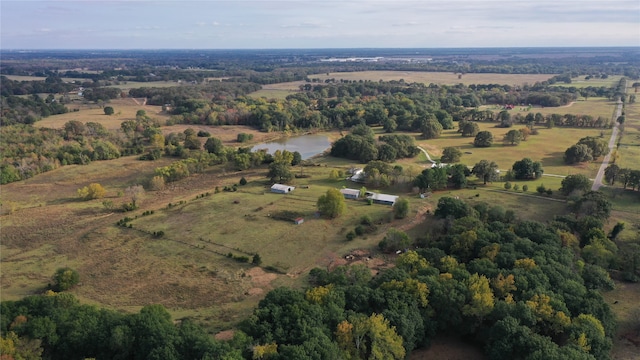 drone / aerial view featuring a water view and a rural view