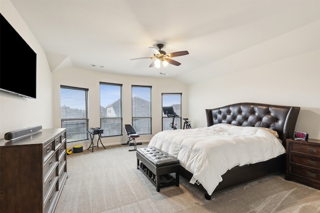 bedroom featuring lofted ceiling, light colored carpet, and ceiling fan