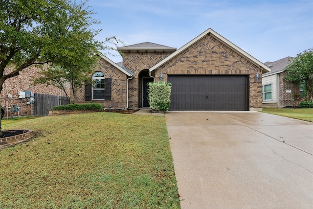 view of front of house with a front lawn and a garage