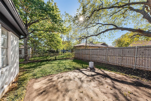 view of yard featuring a fenced backyard and a patio