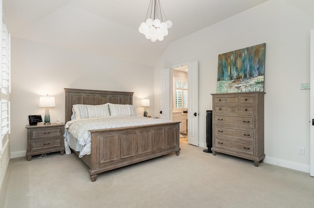 carpeted bedroom with ensuite bath, lofted ceiling, and a notable chandelier