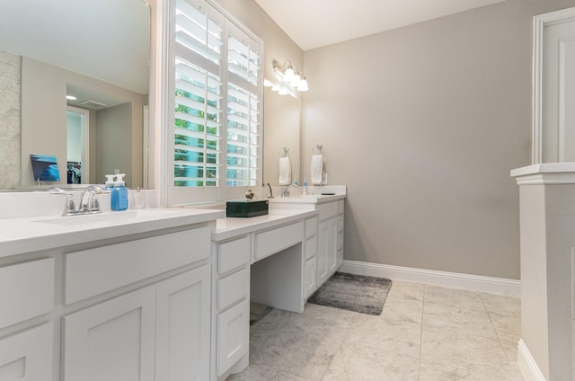 bathroom featuring tile patterned flooring and vanity