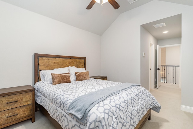 carpeted bedroom featuring lofted ceiling and ceiling fan