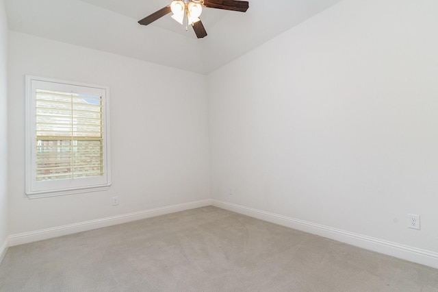 unfurnished room featuring light carpet and ceiling fan