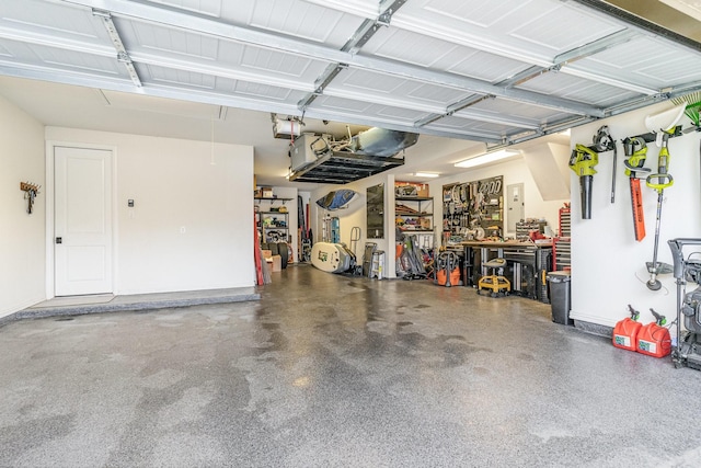 garage featuring a workshop area and a garage door opener