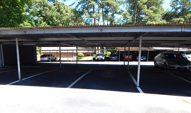 view of vehicle parking with a carport