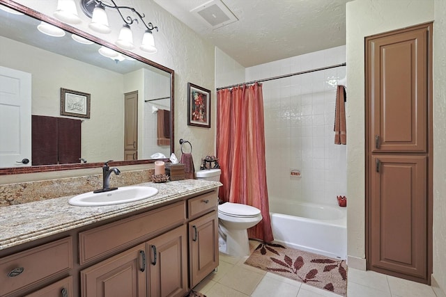 full bathroom featuring vanity, a textured ceiling, shower / bathtub combination with curtain, and tile patterned floors