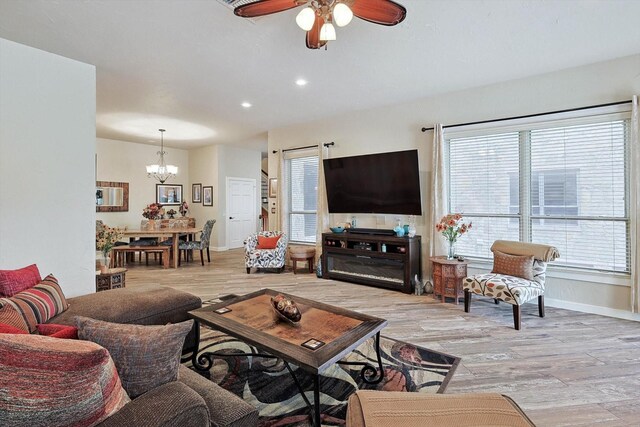 living room with hardwood / wood-style floors and ceiling fan