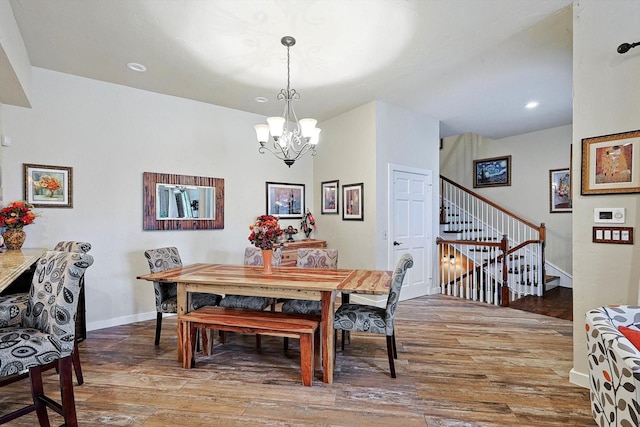 dining room featuring an inviting chandelier and wood-type flooring