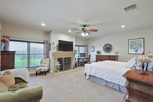 bedroom featuring ceiling fan and carpet