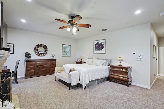 bedroom featuring light colored carpet and ceiling fan