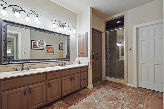 bathroom with an enclosed shower and vanity