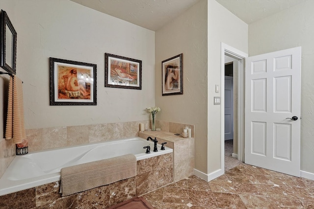 bathroom with tiled bath