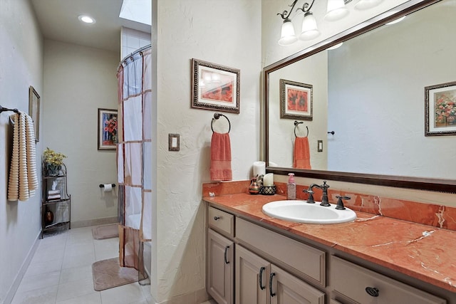 bathroom with tile patterned floors, vanity, and a shower with shower curtain