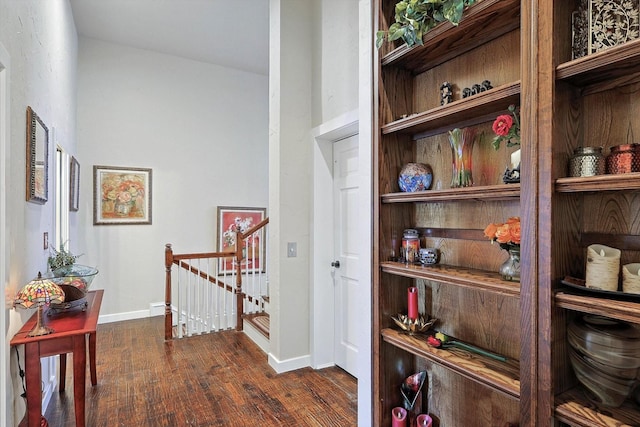 hall with dark hardwood / wood-style floors