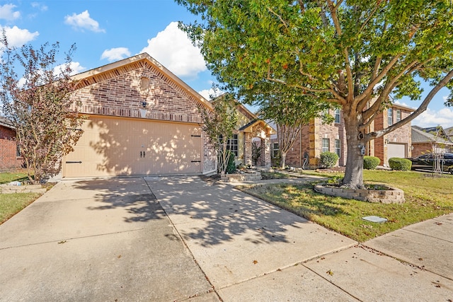 view of front property featuring a garage and a front yard