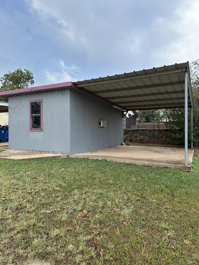 exterior space featuring a yard and a carport