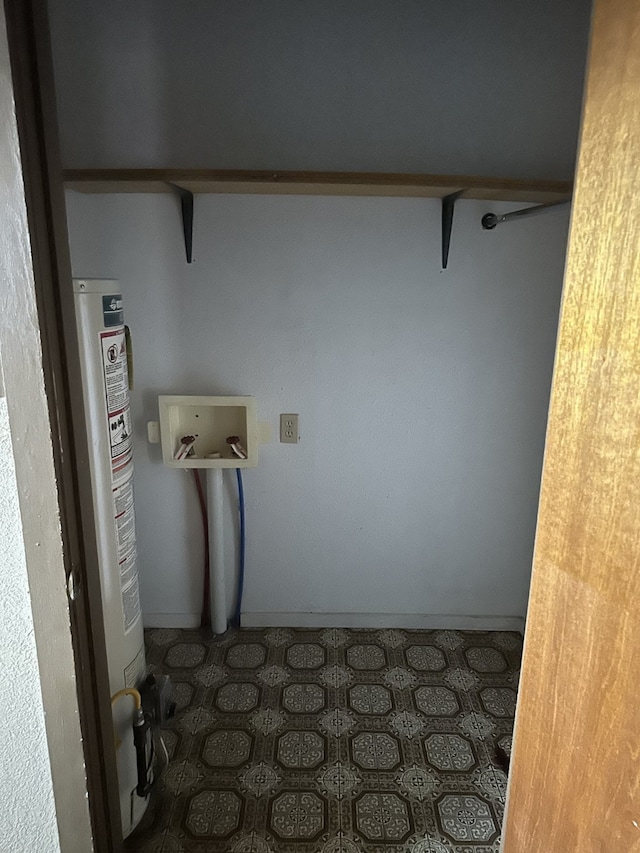200 W Oklahoma Ave, Sweetwater, TX 79556 - laundry area with washer hookup, gas water heater, and tile patterned floors