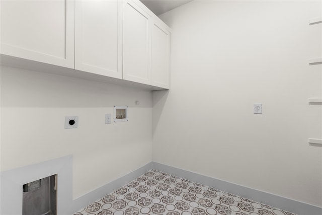 laundry room with electric dryer hookup, cabinets, and washer hookup