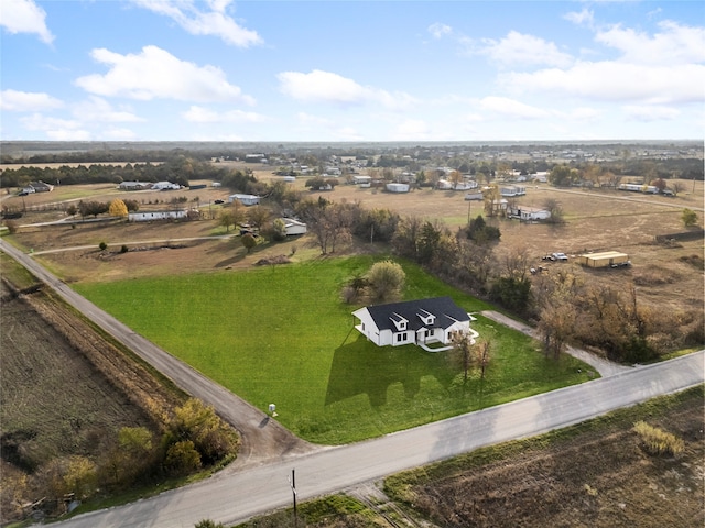 birds eye view of property with a rural view