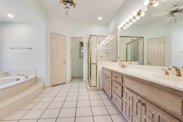 full bath with tile patterned flooring, a garden tub, double vanity, a stall shower, and a sink