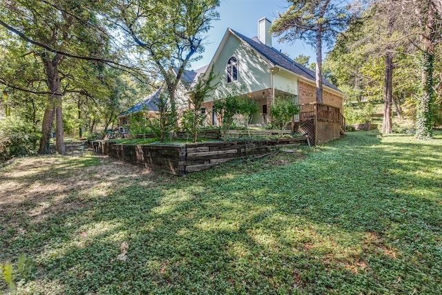 view of yard with a wooden deck