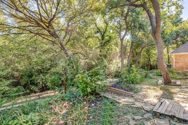 view of yard with a forest view