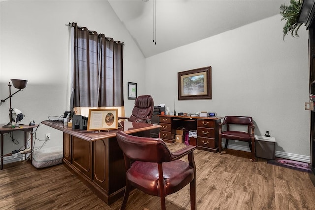 home office with lofted ceiling and hardwood / wood-style flooring