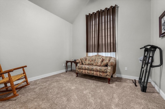 living area featuring vaulted ceiling and carpet floors