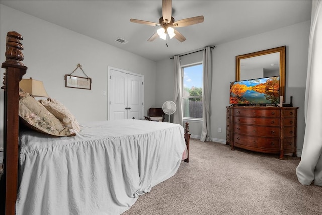 bedroom featuring ceiling fan, a closet, and carpet floors