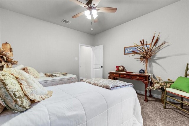 bedroom featuring light carpet and ceiling fan