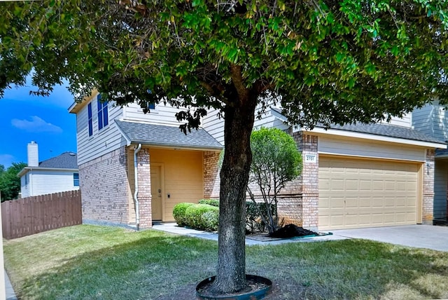 view of front of property with a garage and a front yard