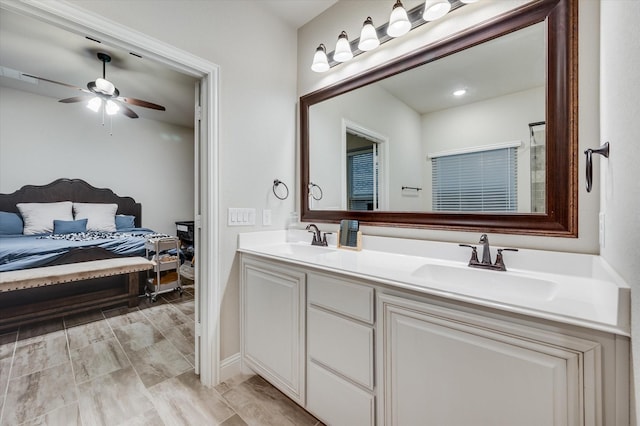 bathroom with ceiling fan and vanity