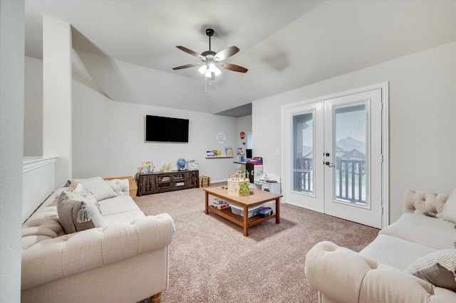 carpeted living room featuring ceiling fan and french doors