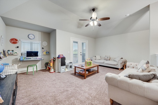 living room featuring lofted ceiling, french doors, ceiling fan, and carpet