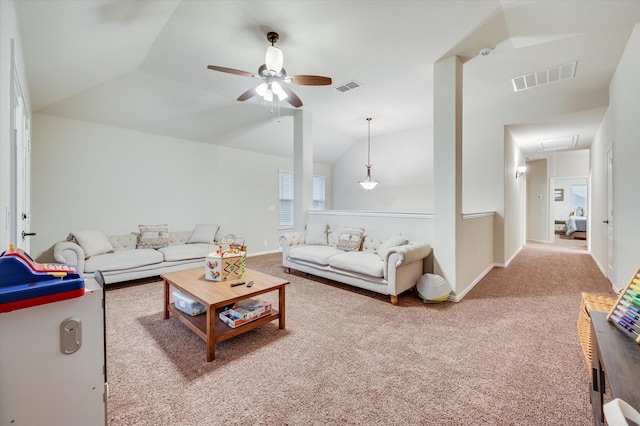 living room featuring ceiling fan, light colored carpet, and lofted ceiling