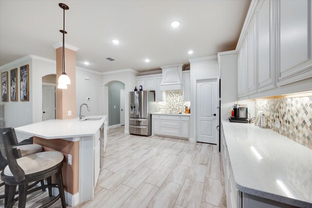 mudroom featuring light hardwood / wood-style flooring and ornamental molding