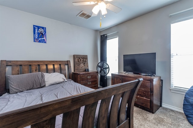 bedroom with light colored carpet and ceiling fan