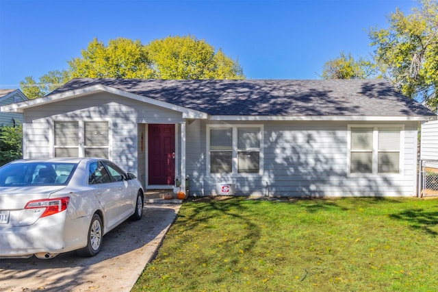 ranch-style home with a front yard