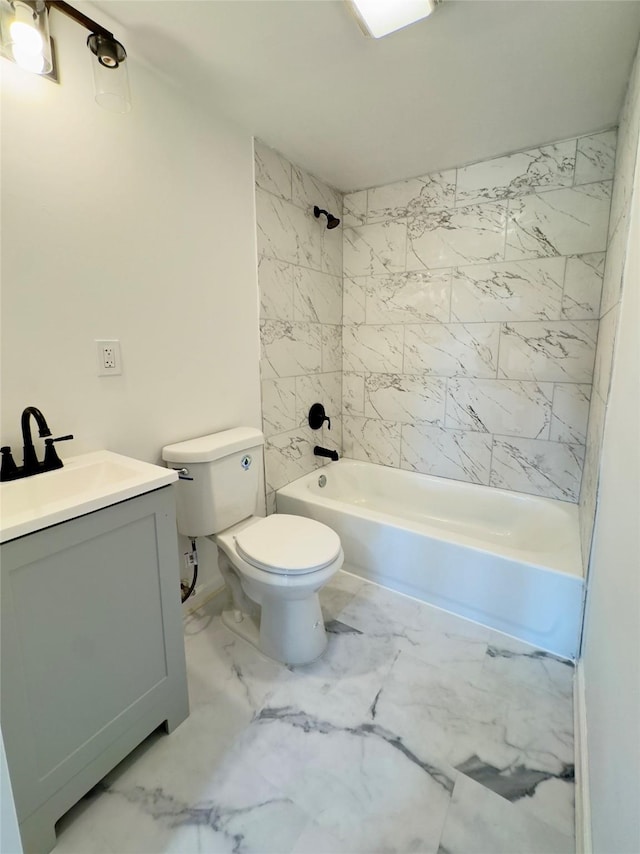 full bathroom featuring vanity, toilet, and tiled shower / bath combo