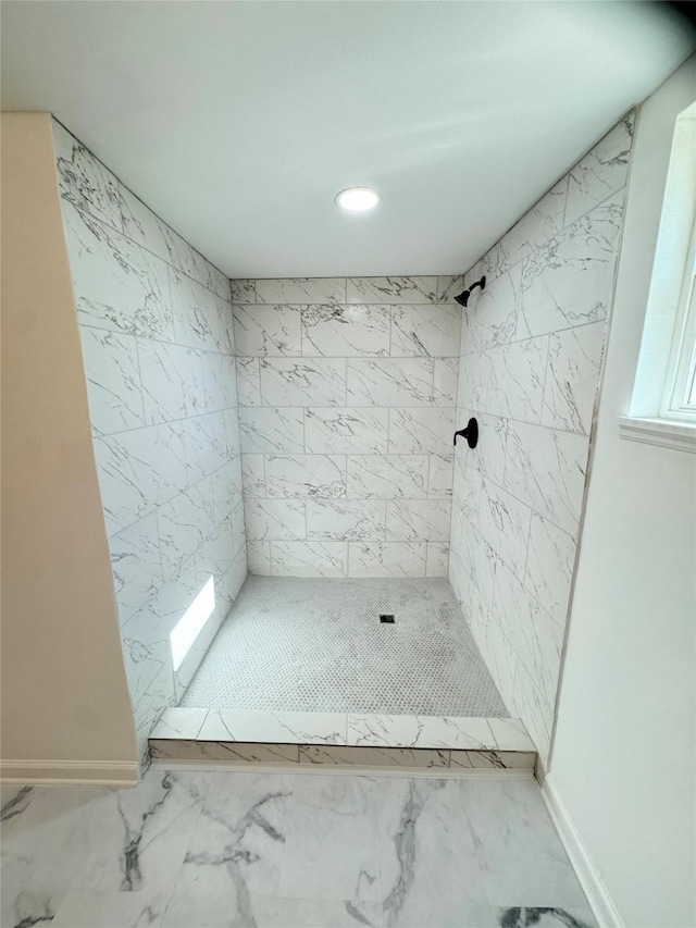 bathroom featuring tiled shower