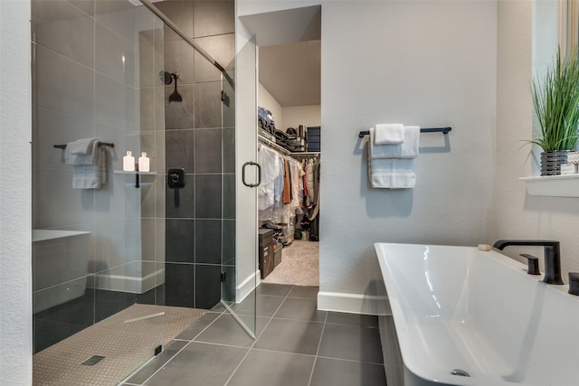 bathroom featuring tile patterned flooring, sink, and shower with separate bathtub