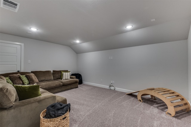 carpeted living room with vaulted ceiling