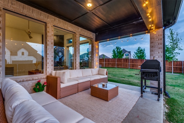 view of patio with an outdoor living space and a grill