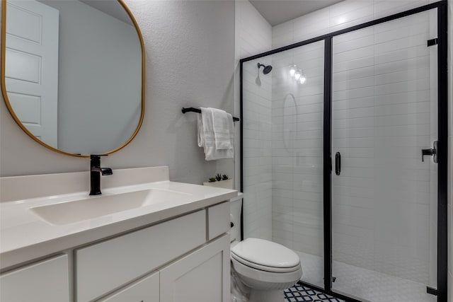 bathroom with vanity, toilet, and walk in shower