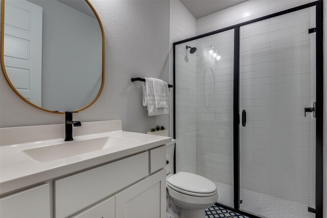 4104 Dartmoor Dr, Aubrey, TX 76227 - bathroom with a stall shower, toilet, vanity, and a textured wall
