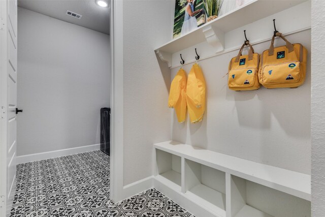 mudroom featuring light tile patterned floors