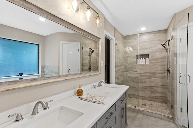 bathroom featuring vanity and an enclosed shower